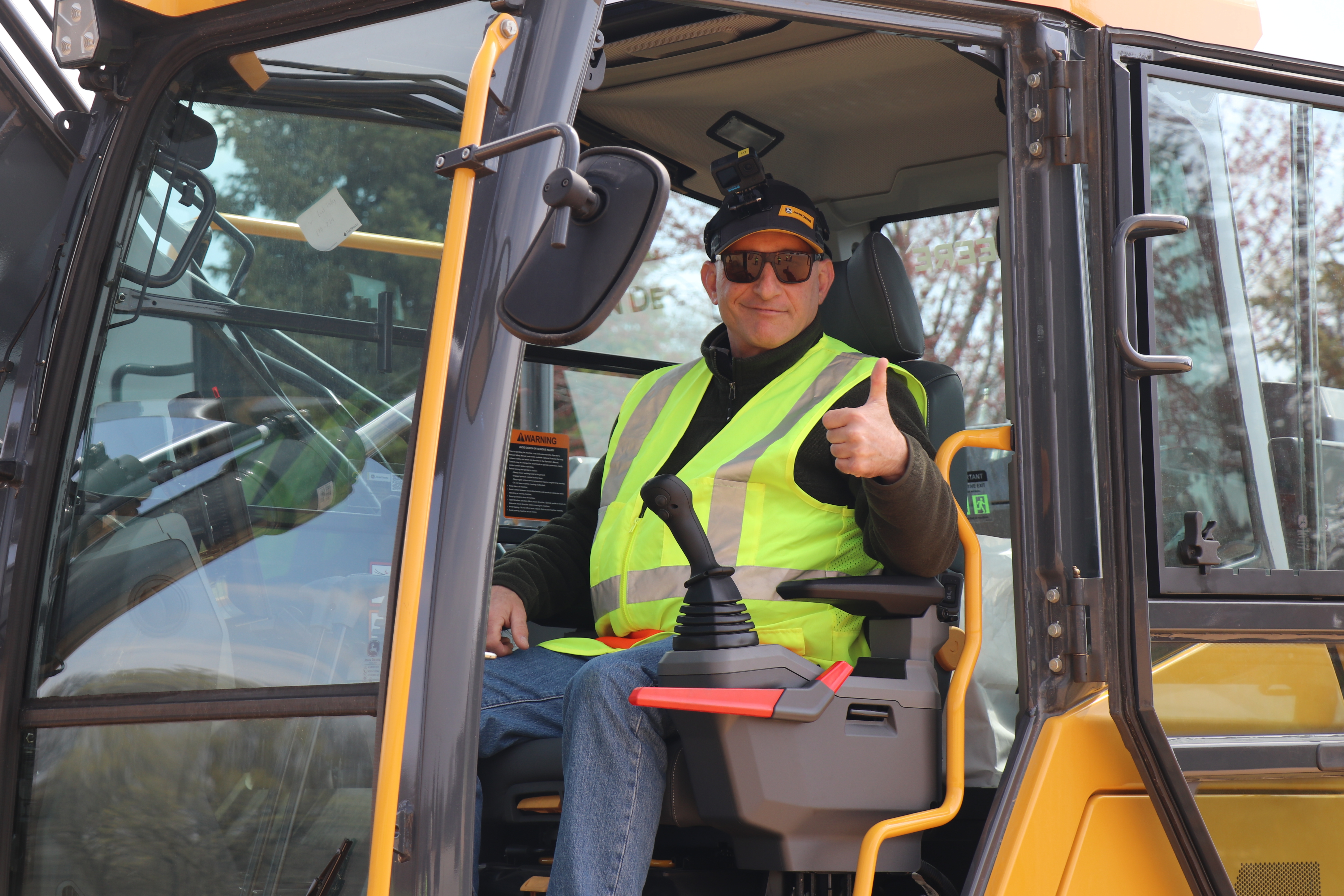 Thumbs-up from excavator cab